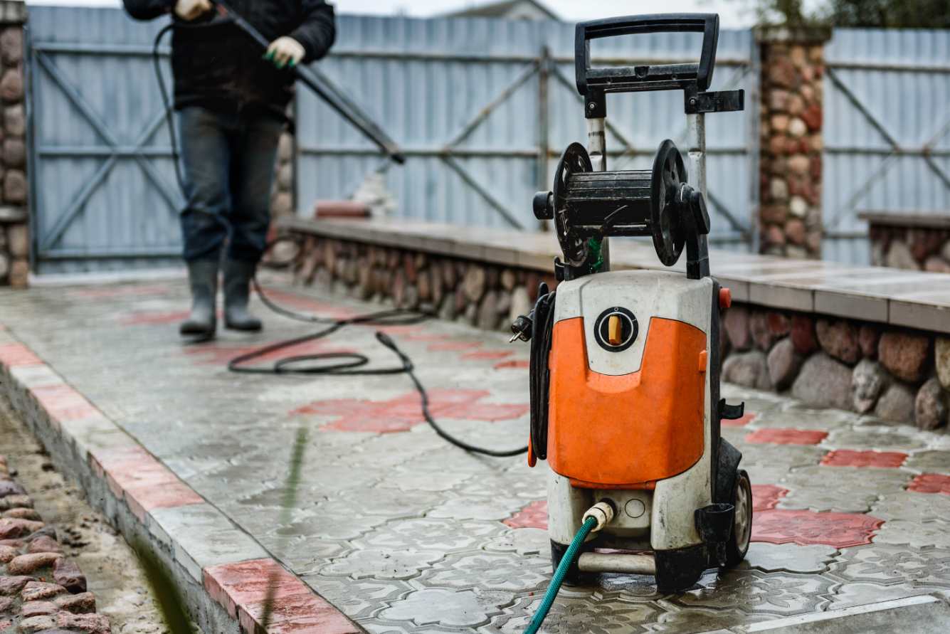 Professional concrete washing and sealing service restoring driveway surfaces
